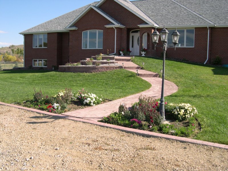 Seeded Lawn and Hardscape Landscaping by Sheridan Lawn and Landscaping, LLC